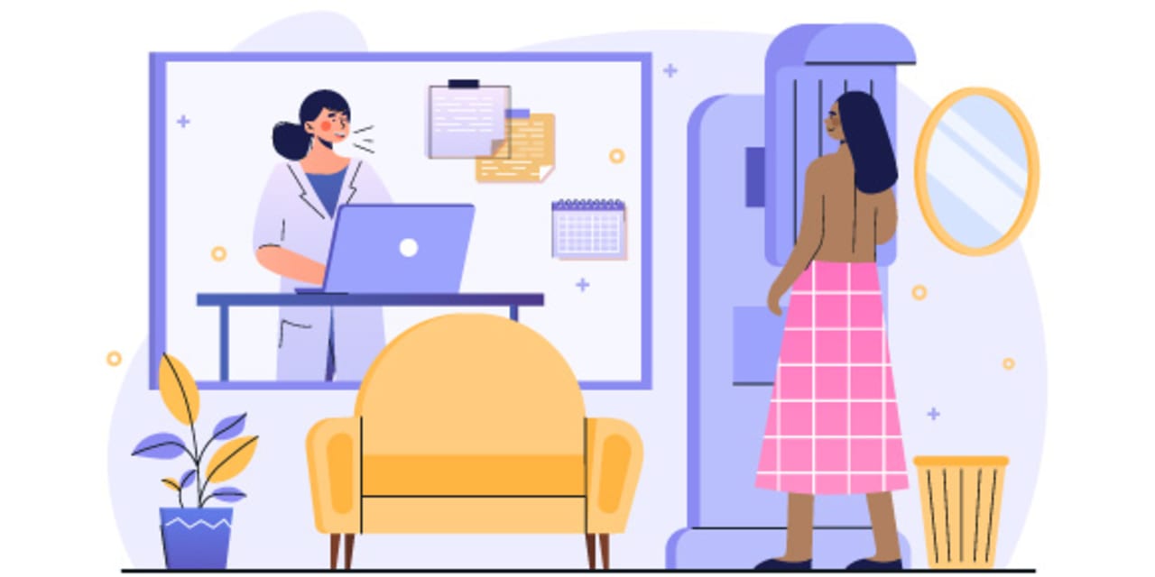 woman getting a mammogram at doctor's office