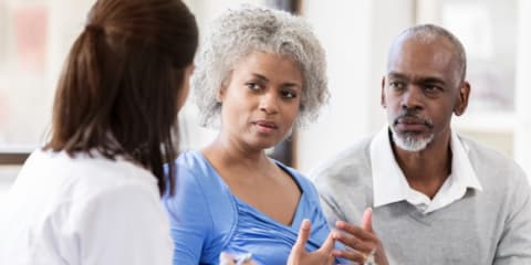 A doctor and a patient conversing