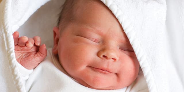 newborn baby wrapped in blanket