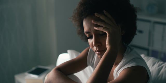a woman having trouble sleeping