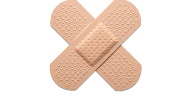 close up picture of two bandaids representing first aid