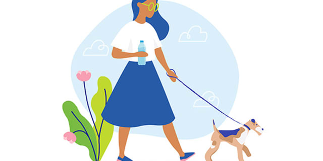 woman walking dog in the afternoon