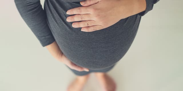 a woman ponders pregnancy myths