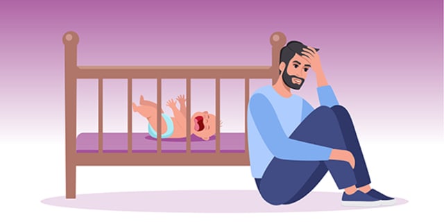Frustrated parent sitting next to crib with a infant crying in it