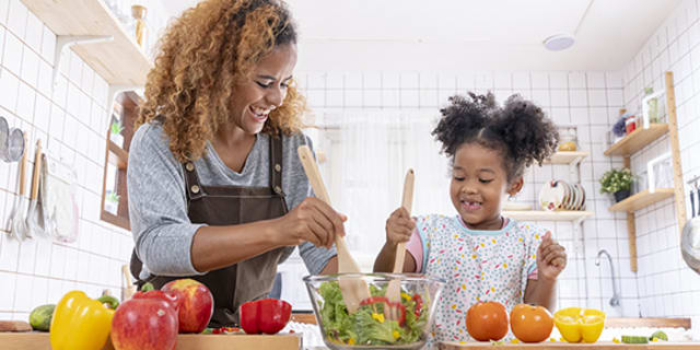 A mother and daughter cooking for diabetes