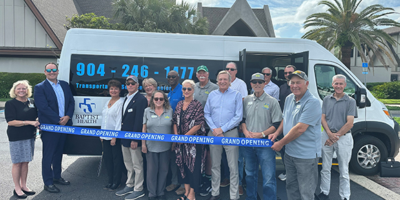 Group of people standing outside of a dial-a-ride van