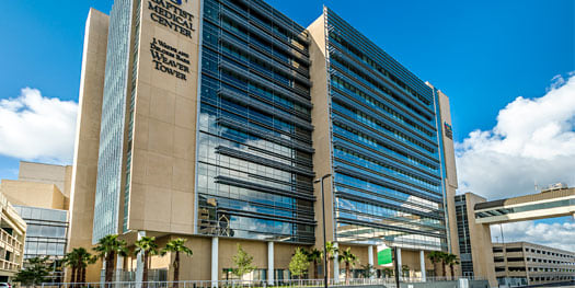baptist medical center jacksonville building exterior with blue sky and clouds in the background