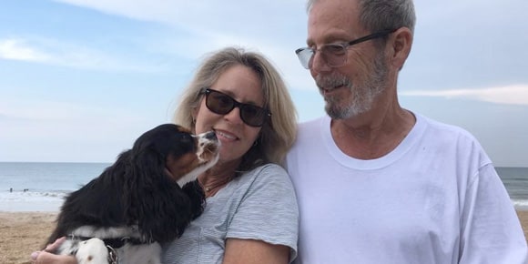 John Bowler with wife and dog on the beach