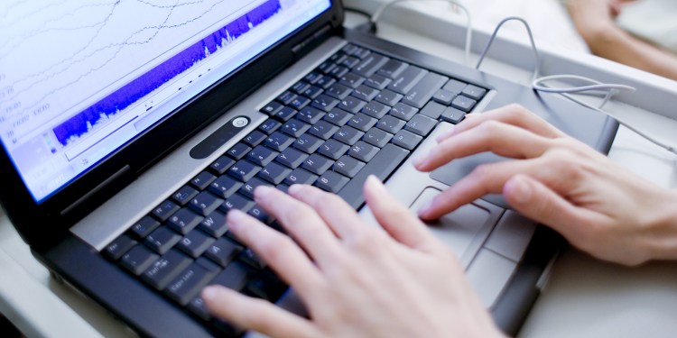 laptop monitoring sleeping patient