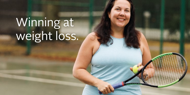 A woman who had weight loss surgery stands on a tennis court holding a ball and racquet while smiling. Text reads "Winning at weight loss"