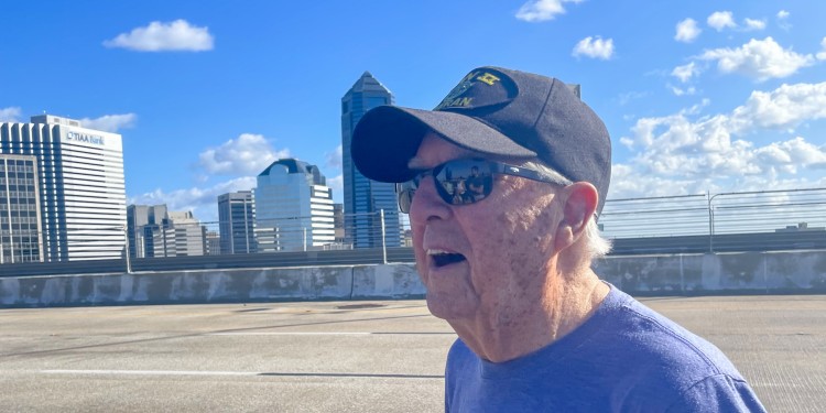 senior man in hat on Acosta bridge in Jacksonville, FL