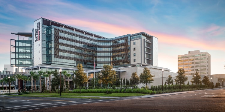 exterior shot of Baptist MD Anderson Cancer Center at sunrise