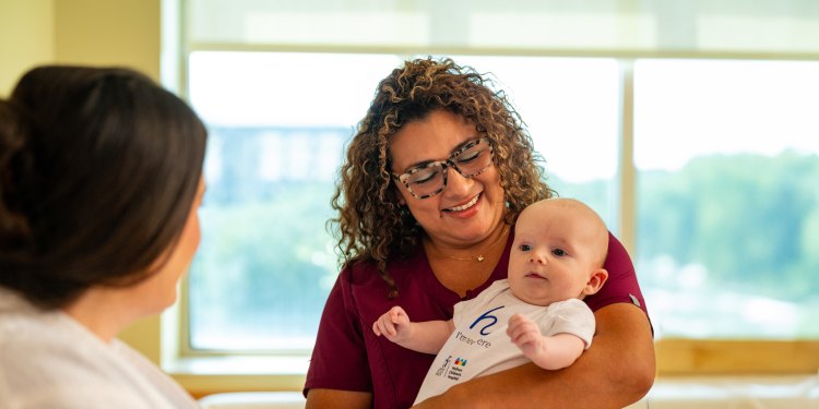 baby in baptist health/wolfson children's onesie