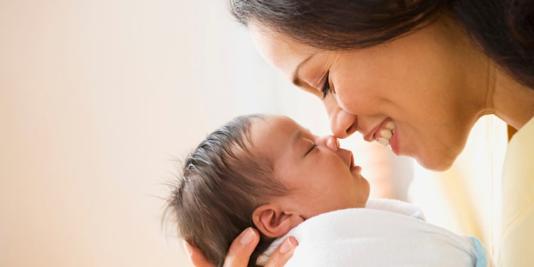 newborn photo with mom in hospital birthing suite