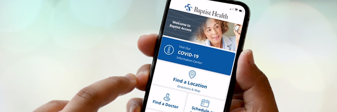 close up of hand holding Baptist Access app on iPhone
