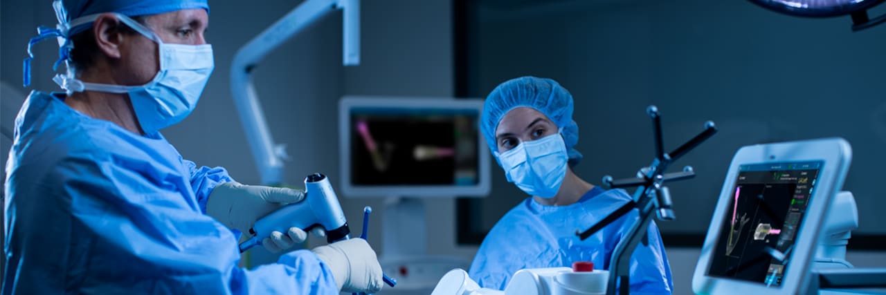 surgeon performing robotic spine surgery