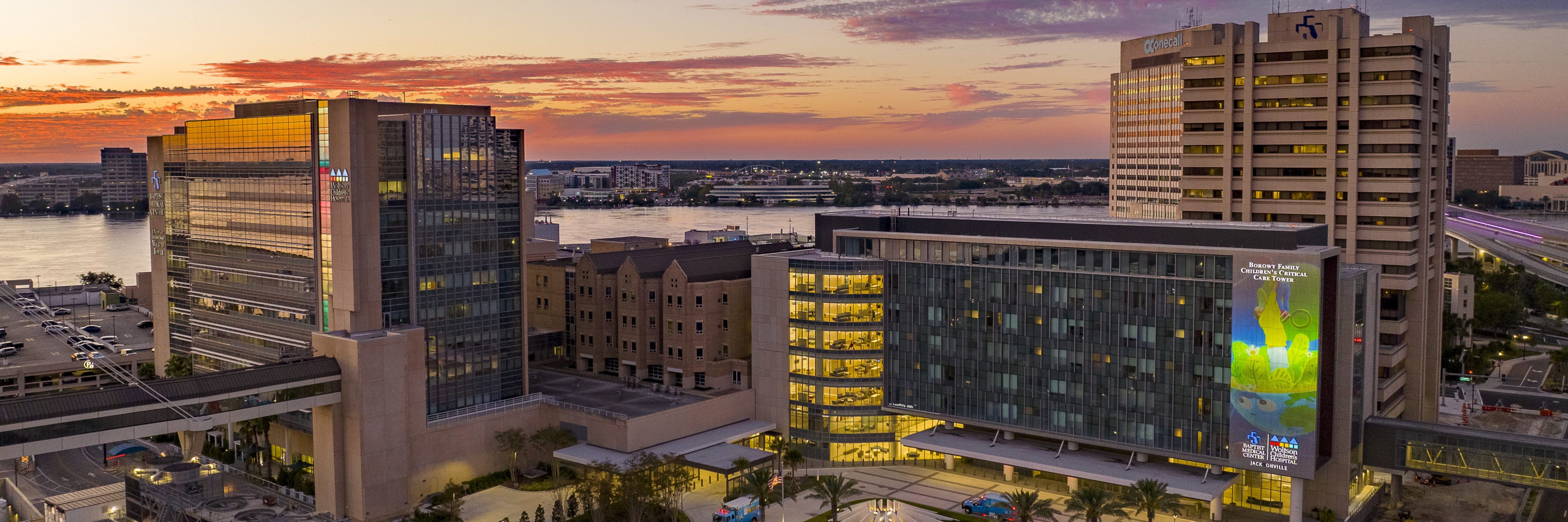 An aerial view of the Baptist Health and Wolfson Children's downtown Jacksonville campus at sunset.