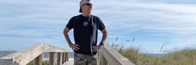 A man enjoys the beach after hernia surgery