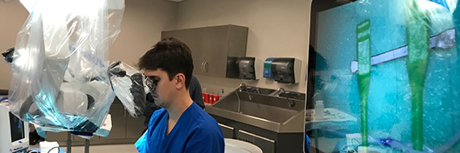Neurosurgeon Ricardo Hanel, MD, demonstrates neurosurgery technology