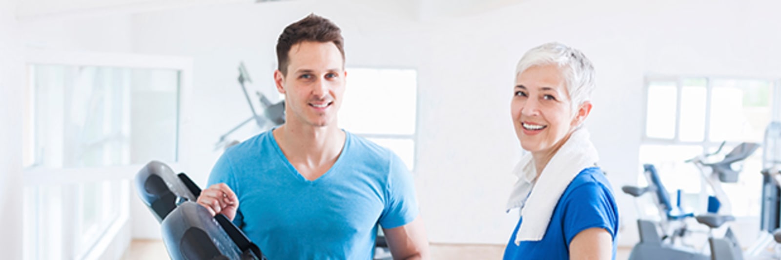 medical professional working with patient on treadmill