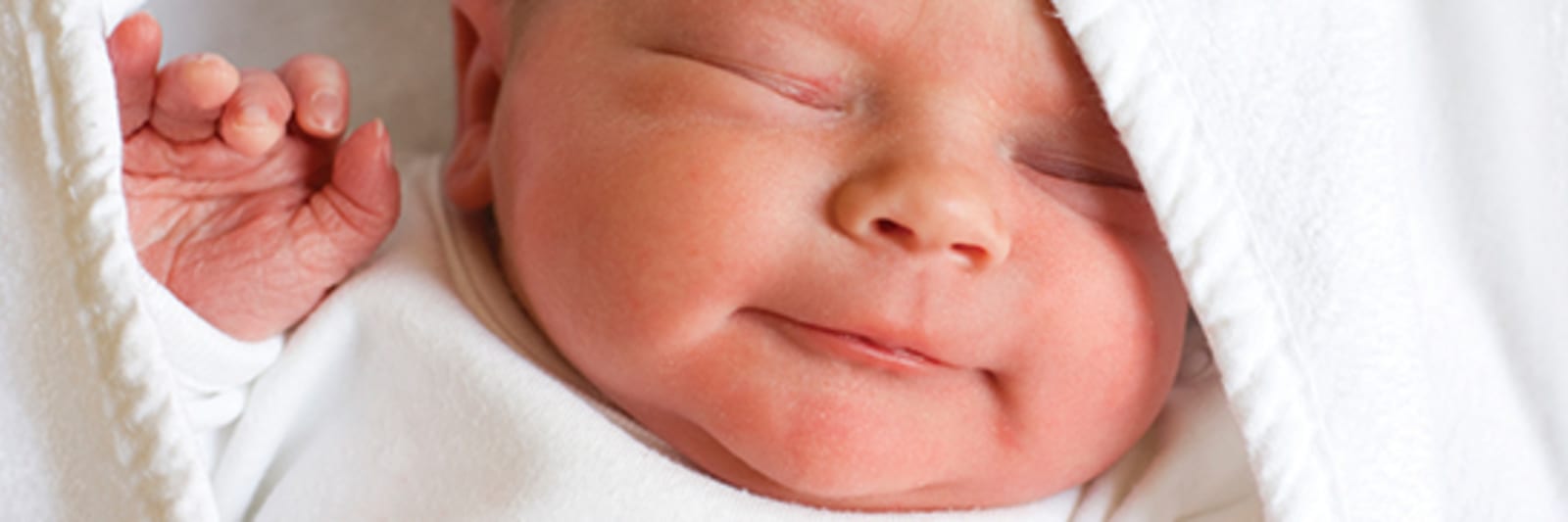 newborn baby wrapped in blanket