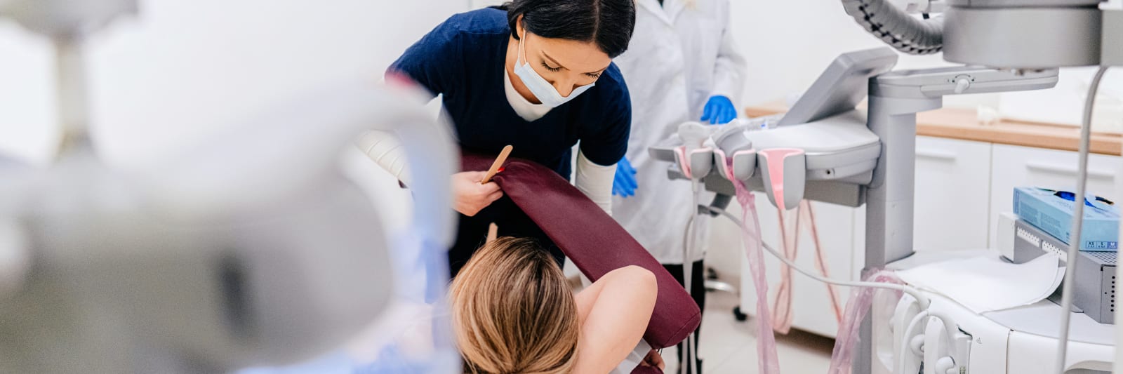 female nurse preparing a patient for the breast examination