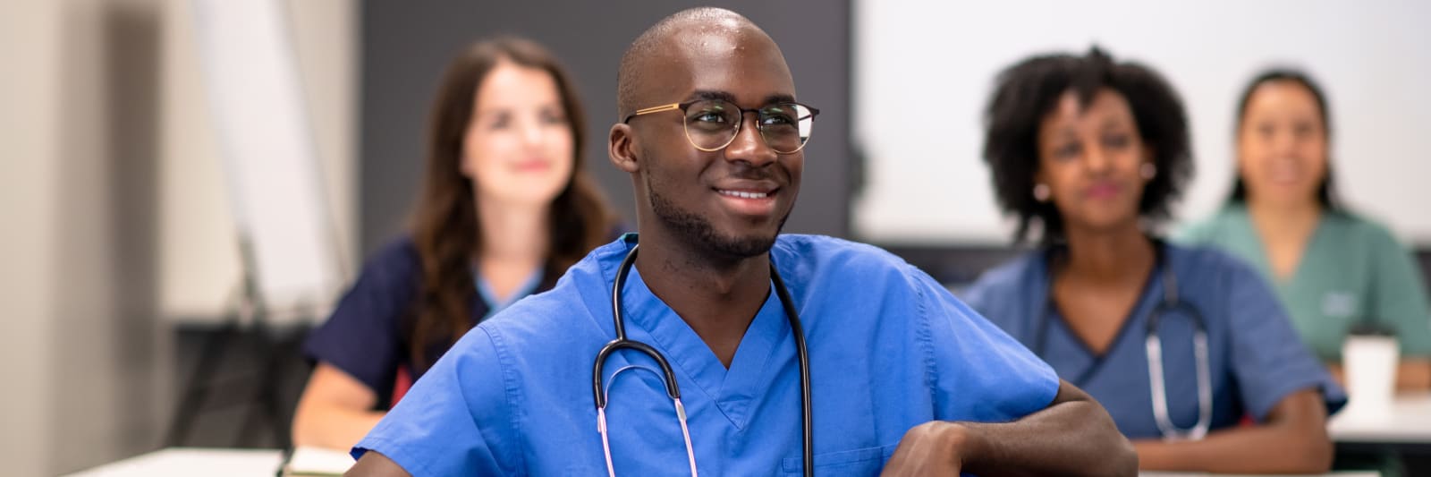 A diverse group of students taking a class at a medical school