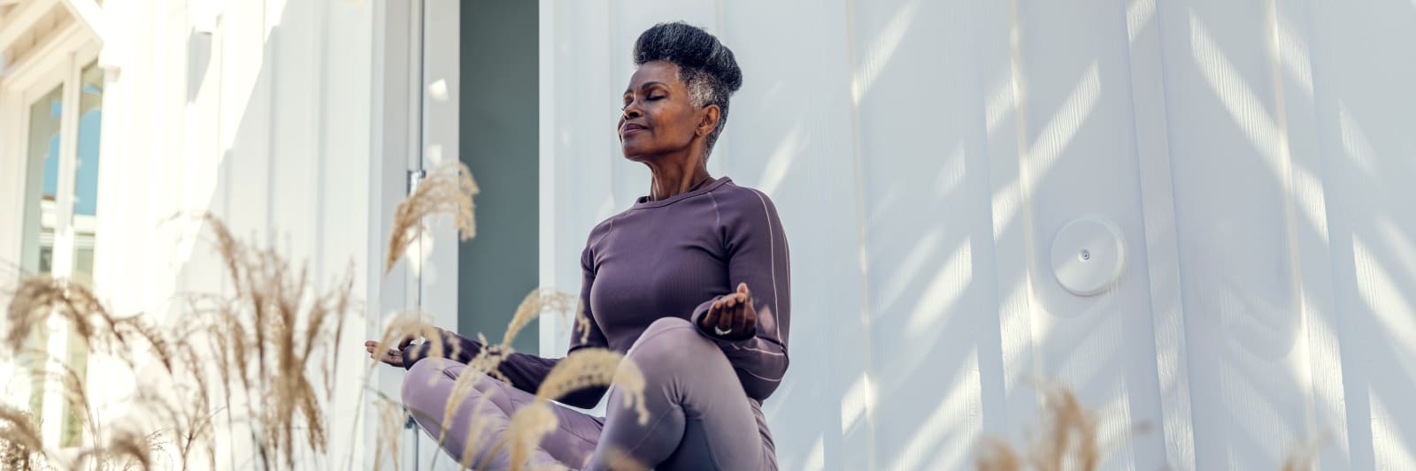 Mature black women meditating outdoors