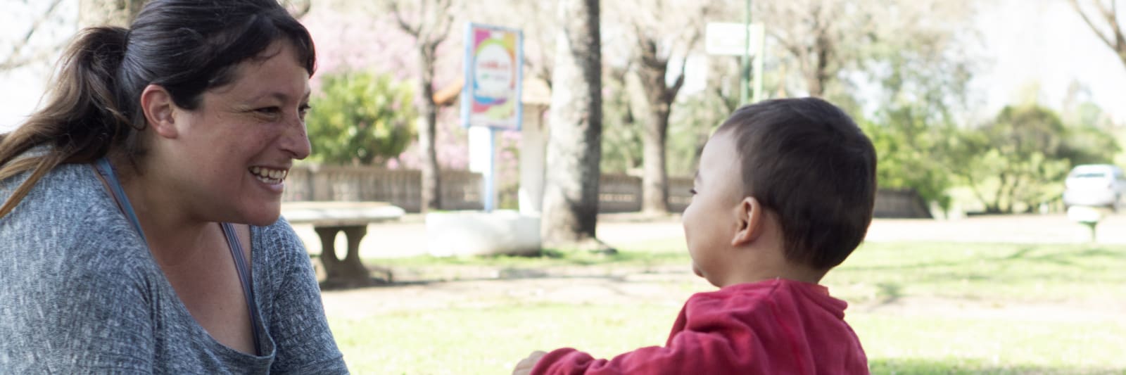 mother and toddler playing at the park