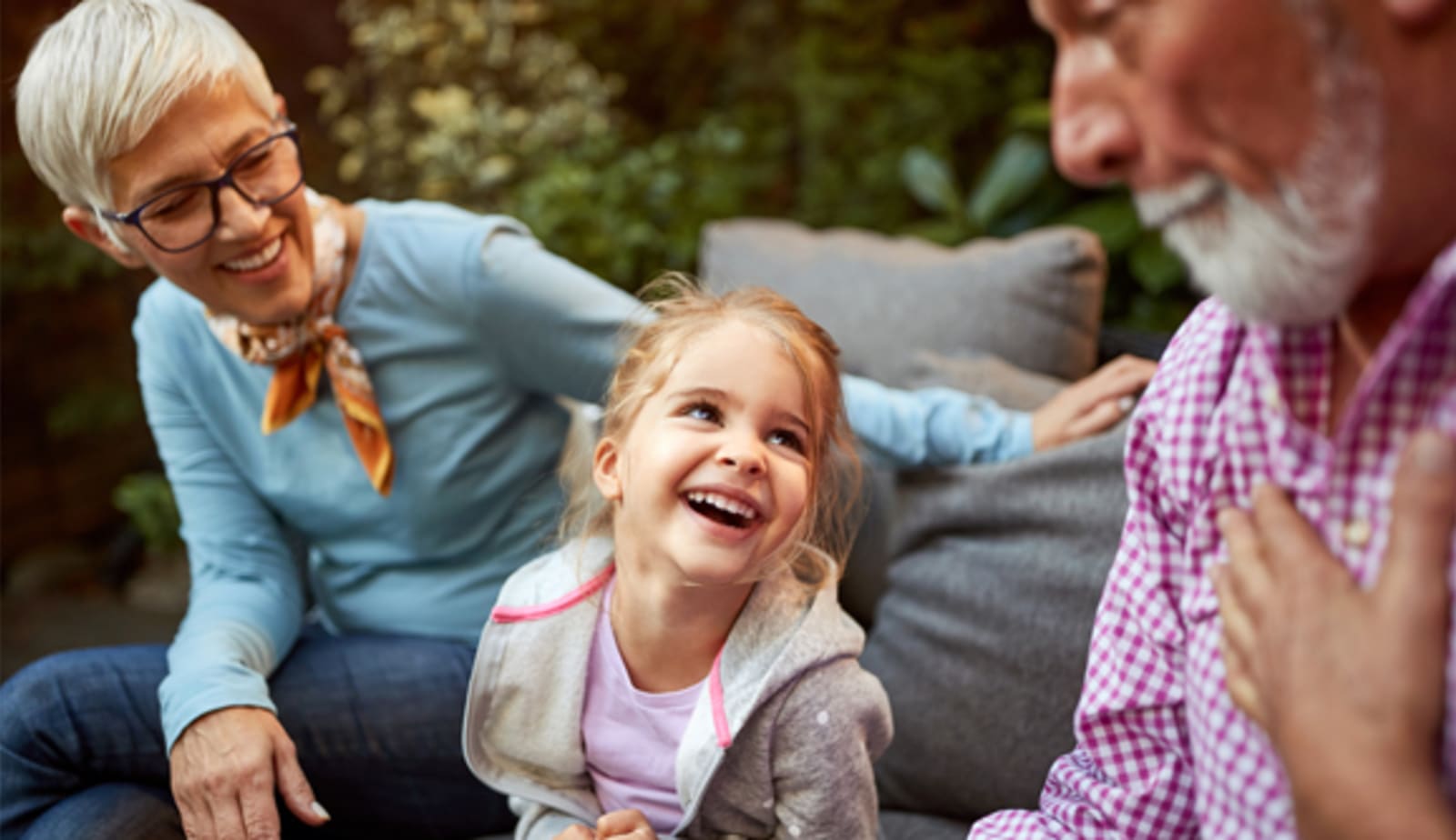 grandparents with young granddaughter