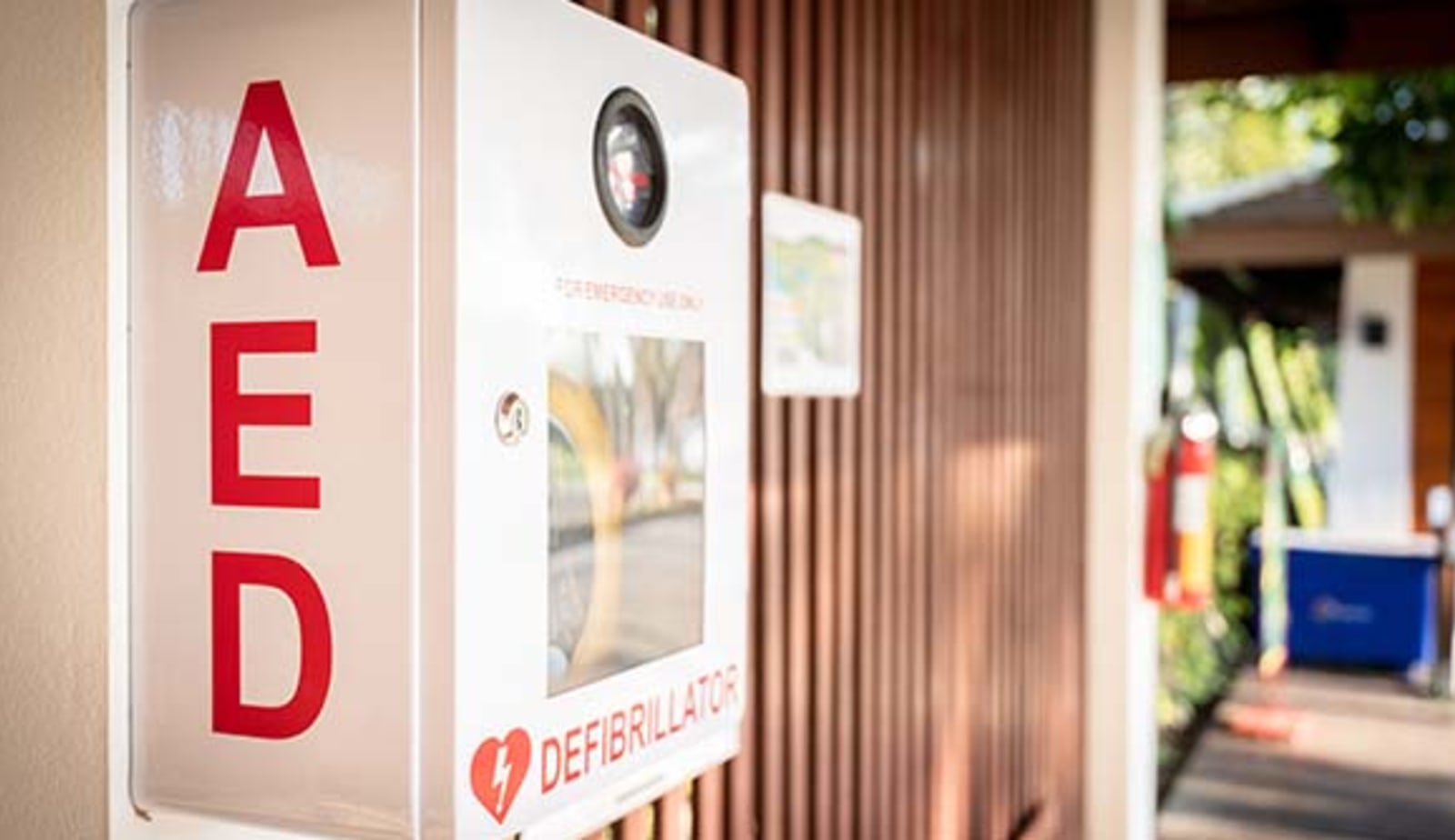 close up of AED hanging on an outside wall
