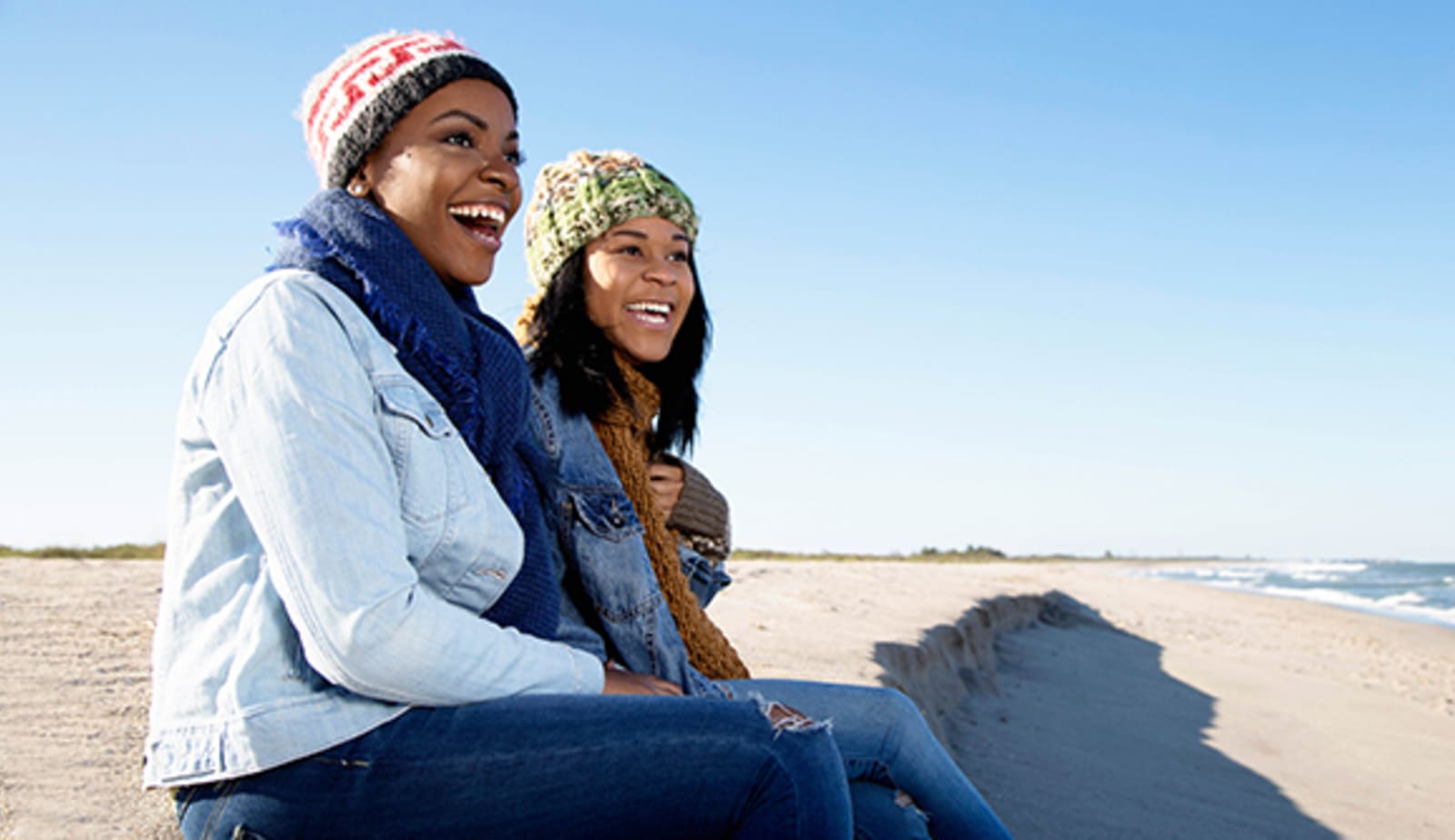 Two women wearing sunscreen during winter