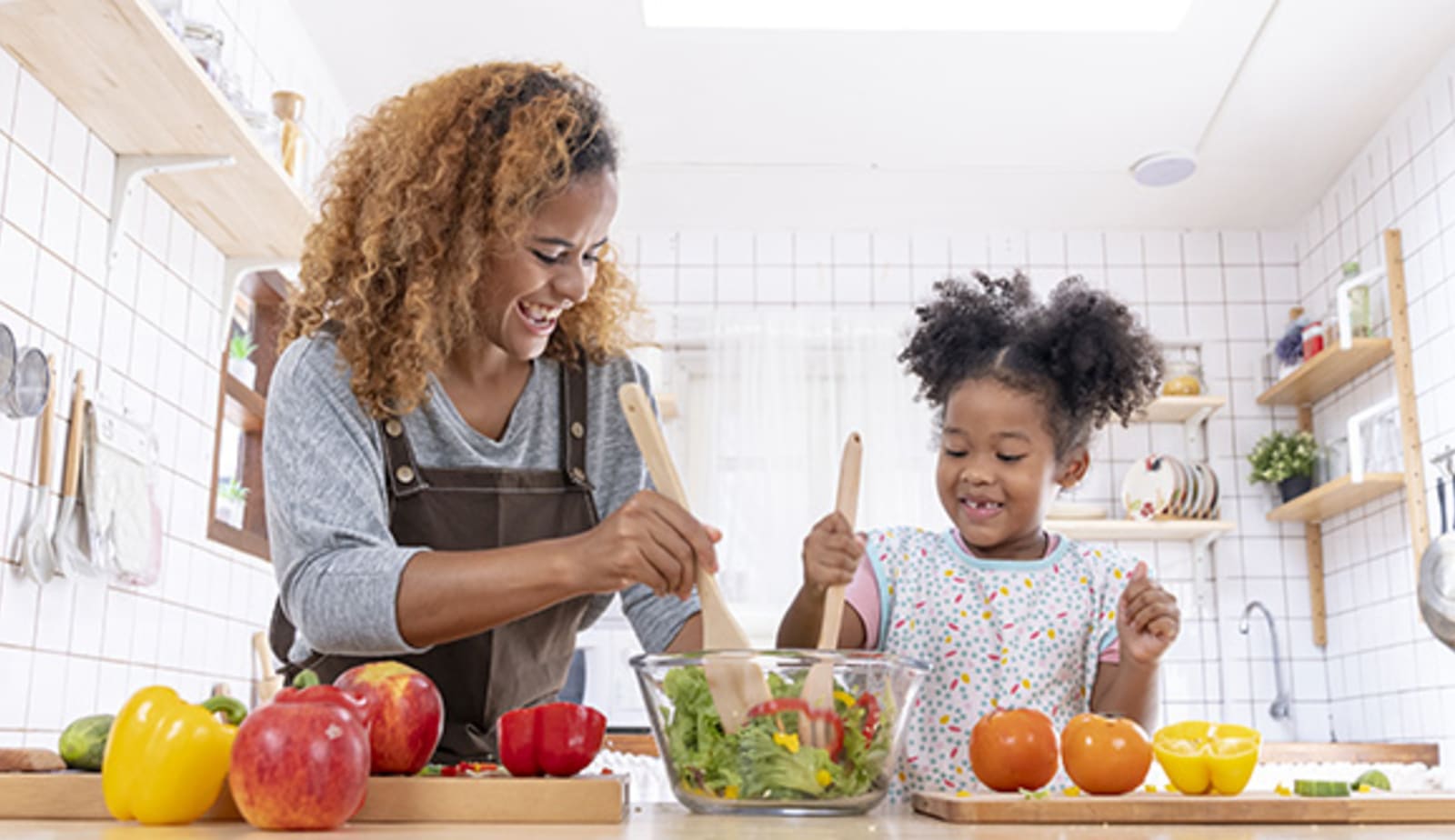 A mother and daughter cooking for diabetes