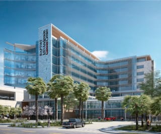 Baptist MD Anderson Cancer Center is a beautiful "L-shaped" building of tinted glass.