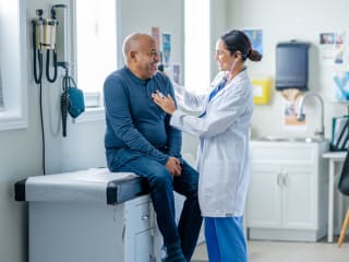 senior with provider in a doctor's office setting
