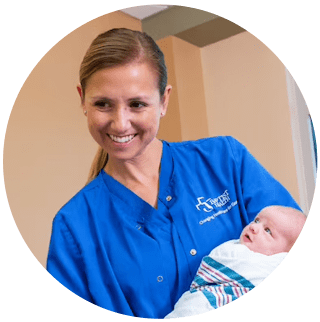 Baptist Labor & Delivery Nurse with baby