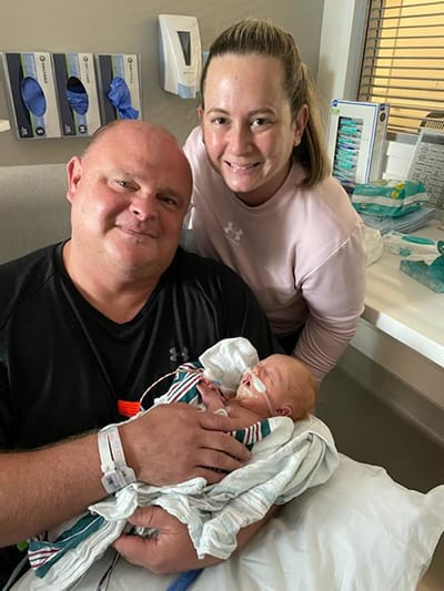 Paul and Tracey Grissom hold baby Emery in the NICU at Wolfson Children's Hospital