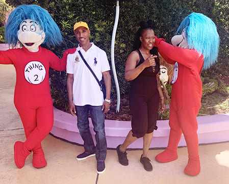 Jennifer May and her husband pose with Thing 1 and Thing 2