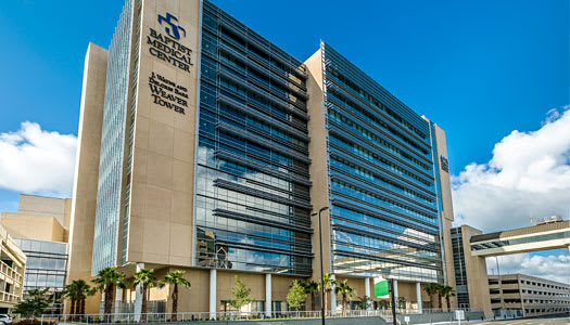 baptist medical center jacksonville building exterior with blue sky and clouds in the background