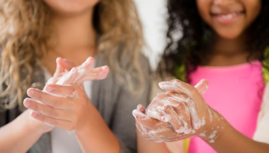 closeup of kids soapy hands