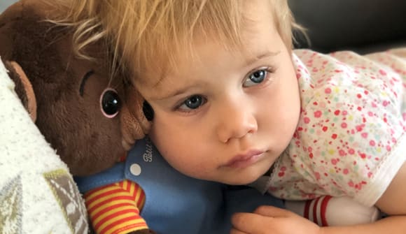 Zelie Satterthwaite hugging a bear