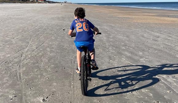 teen riding a bike
