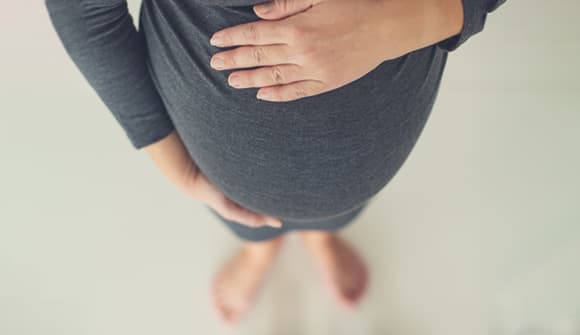a woman ponders pregnancy myths