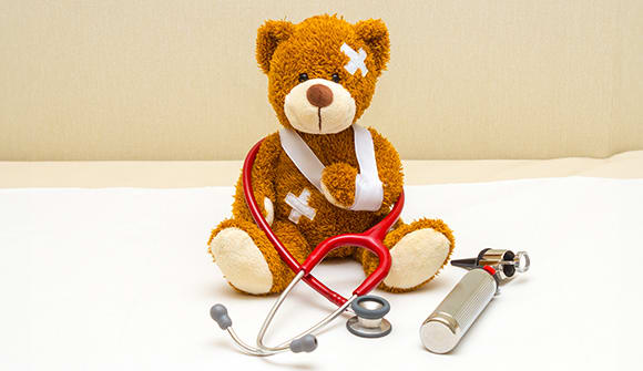 A bear with bandages representing infant emergencies