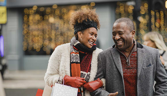 African American couple holiday shopping. 