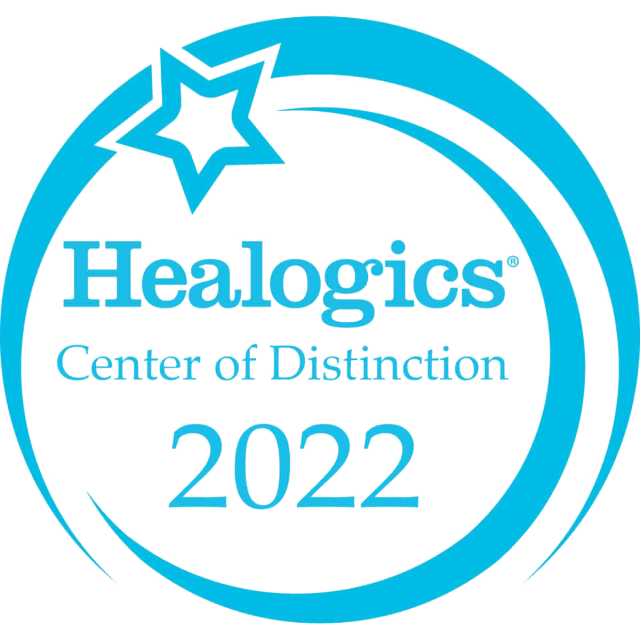 light blue and white award that says "Healogics center of Distinction 2022"