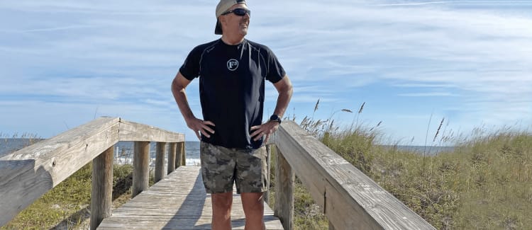 A man enjoys the beach after hernia surgery