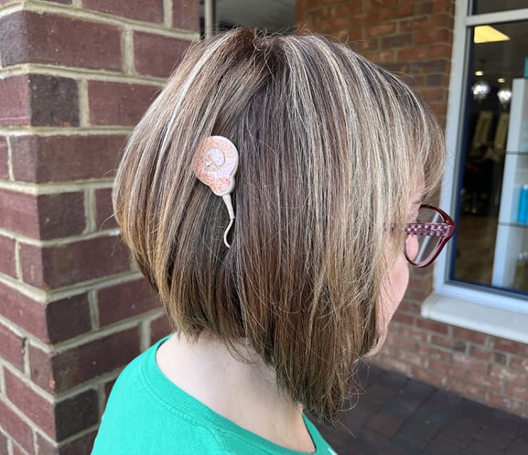 Woman with new cochlear implant