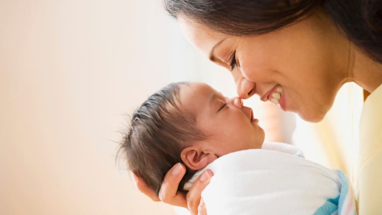 newborn photo with mom in hospital birthing suite