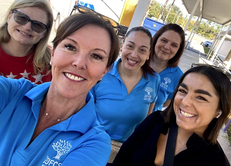 JFCS CEO Colleen Lloyd Rodriguez with team and volunteers.